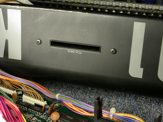 Removing the PCM Data Slot Assembly