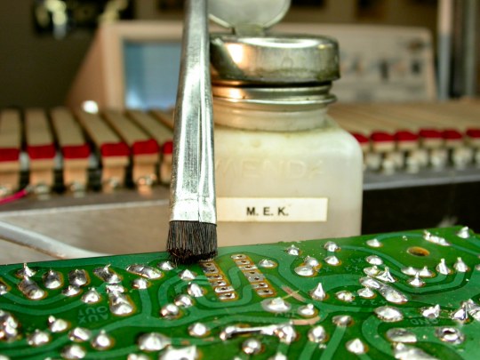 Cleaning out printed circuit holes