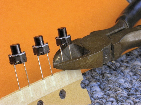 Removing tactile switches from cut tape sections